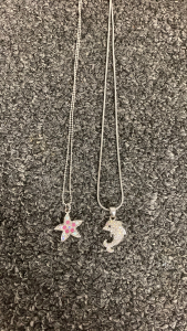 Dolphin and Sea Star Necklaces.