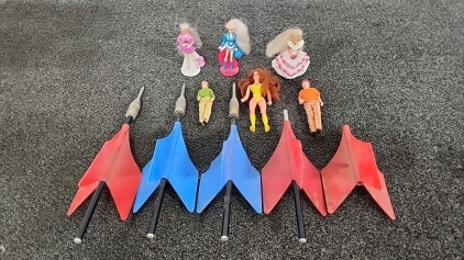 Three Full Lawn Darts(One Broken & One Just Fin), Three Barbie Toys, Two Girl Dolls, & One Superhero Girl