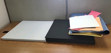 Box of Grey, Black, and Other Colored Foam Padding