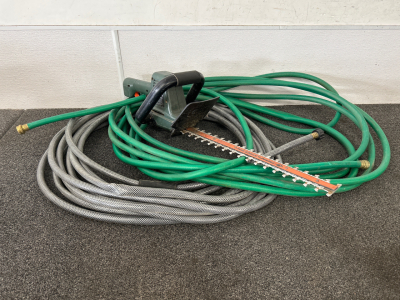 (2) Garden Hoses and a Hedge Hog Trimmer Powers On