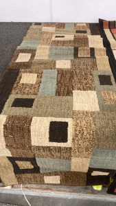 One 24.5 x 70 and one 23.5 x 66 area rugs