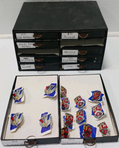 Box With (10) Drawers Full Of Breast Pins