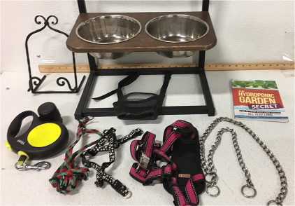 (1) dog food and drink stand w/ Bowls (1) Nylon Mesh Muzzle (1) Kong harness for medium dog (2) harnesses for small dogs (2) choker collars (1) retractable Leash (1) The Hydroponic Garden Secret Book