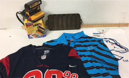 (1) Vintage Corn Roaster (1) Polaroid Job Pro 2 W/ film (1) White BSU Tshirt M (1) Striped and Collared Blue Underarmor Shirt XL (1) NFL Texans 99 Jersey XL