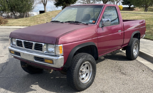 Red 1996 Nissan Pickup