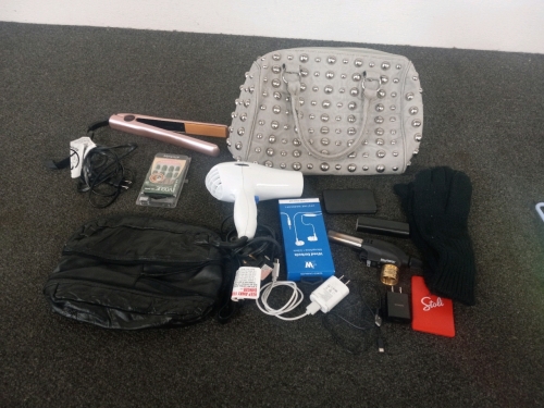 Travel Bag Full Of Personal Items Hair Dryer, Straightener, Ear Buds