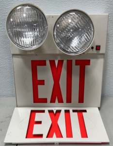 (1) Electric Fire Exit Sign, (2) Fram Fleet-Care CHW 33PL Oil Filters, (1) Box Stainless Steel Band-It Buckles, (2) Boxes of Five Cajon Zero Clearance Pipe Fittings (VCO Connectors), (5) Swagelok #SS-4-CN (VCO Connectors)