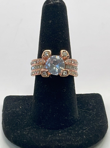 (1) Rose Gold Toned Ring W/ Clear Gemstones Size 8