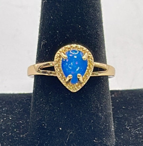 (1) Gold Toned W/ Blue Fire Opal Ring Size 10