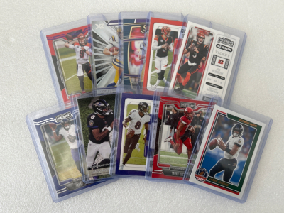 (5) Joe Burrows and (5) Lamar Jackson Sports Cards
