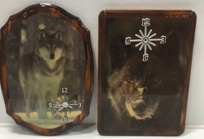 Two Decorative Wolf Clocks