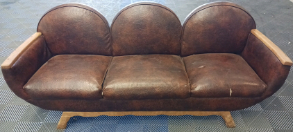 Three Barrel And Leather Couch