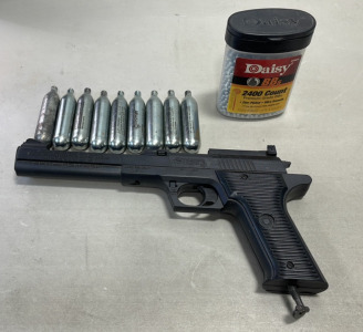 (1) Crossman CO2 BB/Pellet Gun, (9) CO2 Cartridges, (1) Container Daisy BBs