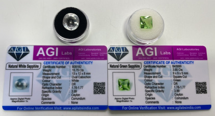 Certified Natural Gemstones (1) 15.75ct Natural White Sapphire Oval Cabochon, (1) 3.65ct Natural Green Sapphire Square Cut. Both With C.O.A.