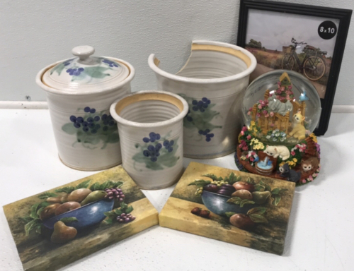 (1) Set of 3 Ceramic Pots (2) Fruit Bowl Canvases (1) Playful Kitten Snowglobe (1) 8”x10” Photo Frame