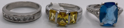 (1) Blue Topaz Colored Gemstone Ring Size 9-1/2, (1) 3 Cut And Faceted Citrine Colored Gemstone Ring Size 10, (1) Cubic Zirconium And Silver Toned Ring Size 11