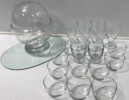 (12) Glass Bowls (6) Tall Pilsner Glasses (2) Small Trifle Bowls (1) Large Glass Bowl w/ Dome Lid (1) 16.5” x 12” Oval Plate of Glass