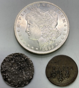(1) 1885 Morgan Silver Dollar, (1) France P Coin, (1) Unknown