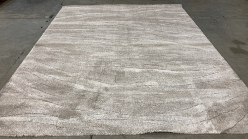 7’10” x 10’ Tan Plush Area Rug