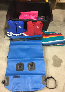 Bin With Youth Life Jackets And Multiple Pool Floaties