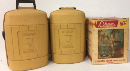 (2) Coleman Laterns In Coleman Yellow Carry Cases, (1) Coleman Caralytic Heater 5000 BTU Model 511A 700