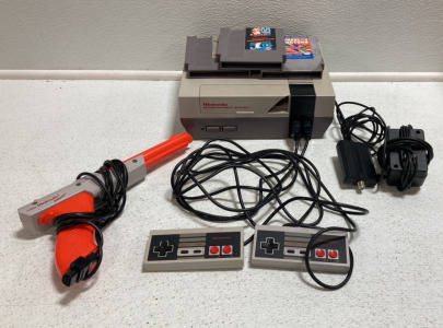 Nintendo Entertainment System w/ Nintendo Zapper, (2) Controllers, Power Cords, Super Mario Bros Duck Hunt, The Goonies 2, Junior Wheel of Fortune