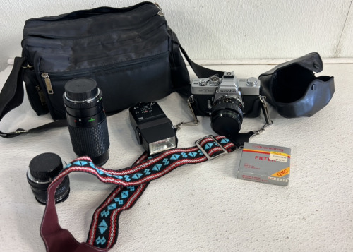 Minolta SRT102 Camera With Lenses, A Carrier and A Camera Bag
