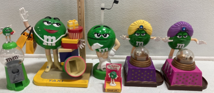 (4) Green M&M Candy Dispensers, (1) Green M&M Cup, (1) Green M&M Mini Figure