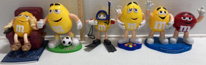 (3) Yellow M&M Candy Dispensers, (1) Yellow M&M Radio, (1) Yellow and Red M&M Candy Dispenser