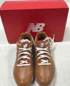 New Balance Cleats.