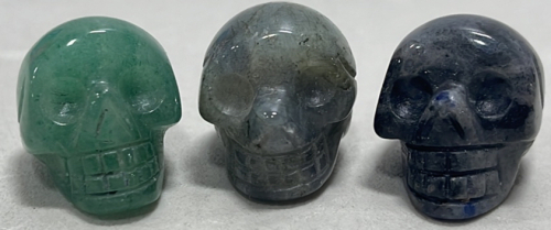 (3) Cut And Polished Crystal Skulls… One 62.65ct Sodalite Skull, One 60.95ct Labradorite Skull, One 57.50ct Adventurine Skull