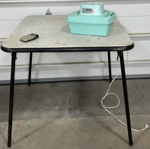 Black and White Foldable Card Table With Vintage Pocket Radio, and Atlas* Vintage Humidifier