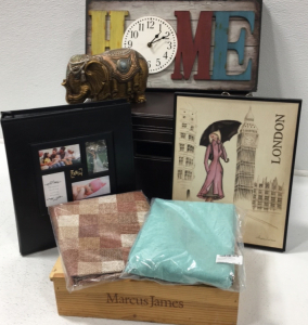 (1) Storage Box (1) “Home” Clock (1) Family Photo Album (1) London Wall Decor (1) Linen Tablecloth (1) Round Vinyl Tablecloth (1) Wooden Marcus James Box (1) Decorative Elephant