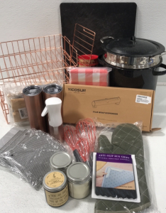 (1) Cuisinart Double Boiler Pot (1) Pair of Oven Mits (1) Film Wrap Dispenser (3) Whisks (3) Scented Candles (8) Silicone Pads (2) Travel Mugs (1) Sprayer (1) 6pcs Cleaning Tool (1) Cutting Board (1) Storage Rack (1) Checkered Tablecloth (2) Plastic Penny