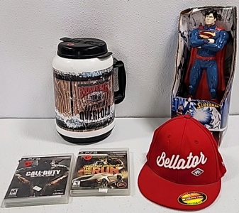 Baseball Cap, (2) PS3 Games, Superman Coin Bank, Maverick 100 oz Cup