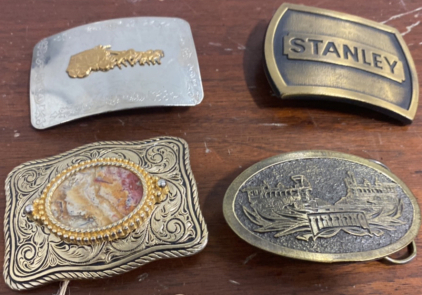 (1) Silver Belt Buckle With Golden Metal Horse Pulling Carriage, (1) Bronze Colored Metal Stanle Belt Buckle, (1) Lace Agate Stone Marbled Metal Belt Buckle, (1) Worn Silver Colored Metal &ldquo;Fireking&rdquo; Belt Buckle