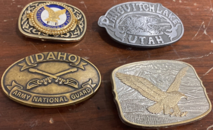 (1) Fraternal Order of Eagles Eagle Belt Buckle(1) Pangutich Lake Utah Belt Buckle, (1) Silver and Gold Colored Eagle Belt Buckle, (1) IDAHO Army National Guard Belt Buckle
