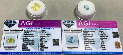 (1) 9.85ct Natural Yellow Sapphire Emerald Cut And Faceted, (1) 1.40ct Natural Aquamarine Oval Cut And Polished W/ COA