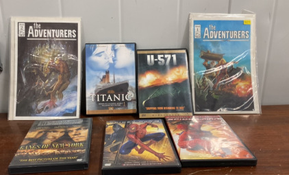 (1) Titanic DVD (1) U-571 DVD, (1) Spider Man 1 and Spider Man 3 DVDs (2) The Adventurers Comic Books