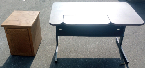 (1) 48" x 30" x 29" Metal Base Wood Top Drafting Style Desk (1) 18" x 21" x 24" Side Table With Wheels