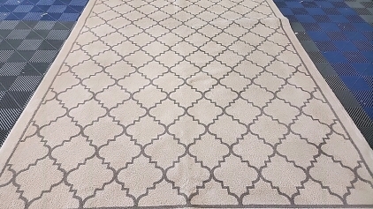 Tan Rug with Geometric Shapes