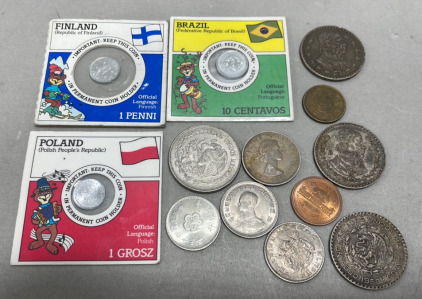 (1) Finland Penny 1979 Carded, (1) Brazil 10 Centavos 1987 Coin Carded, (1) Polish 1 Grosz Coin Carded, (10) Various Coins Of The World