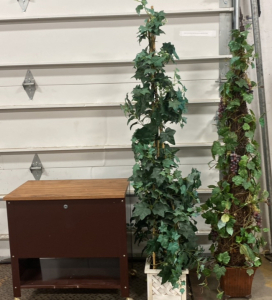(1) Small Brown Side Table On Wheels, (2) Inside Household Plants Fake