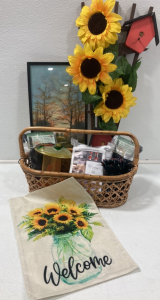 11”x21” Framed Print; Wooden Sunflower Decoration; (2) Finch Thistle Socks-2pack; Bird Feeder; 72ft Solar LED String Lights; Poultry Feeder Kit; “Welcome” Flag; Wicker Basket