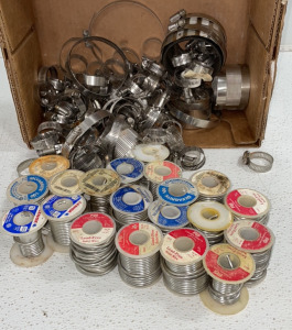 ((20) Rolls Of Solid Metal Wire, And (50+) Clamp Rings