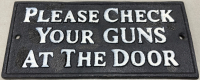 (1) Cast Iron Sign “Please Check Your Guns At The Door” 7-1/2” x 3-1/2”