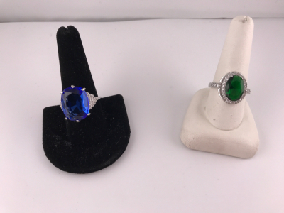 (1) Beautiful Size 10 Oval Cut Faceted Blue Topaz.925 Ring (1)(1) Beautiful Size 10 Oval Cut Faceted Emerald .925 Ring