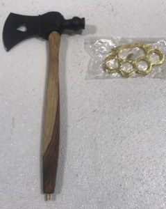 (1) 4&rdquo; hatchet piece pipe (1) gold brass knuckles