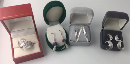 (1) Pair Medium Size Silver Hoop Earrings; (1) Pair Silver Dangling Double Moon Earrings; (1) Size 9 Silver Leaf Ring ; (1) Pair Dangling Pink and Blue Spiked Balls w/ Silver Leaf Earrings