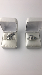 (1) Size 6.5 Silver Band Blue Saphire Ring G. Wt: 4.85 Gms S. Wt: 0.5 Cts ; (1) Size 6.5-7 Silver Band Blue Saphire Ring G Wt: 5.95 G ms S. Wt: 1.35 Cts